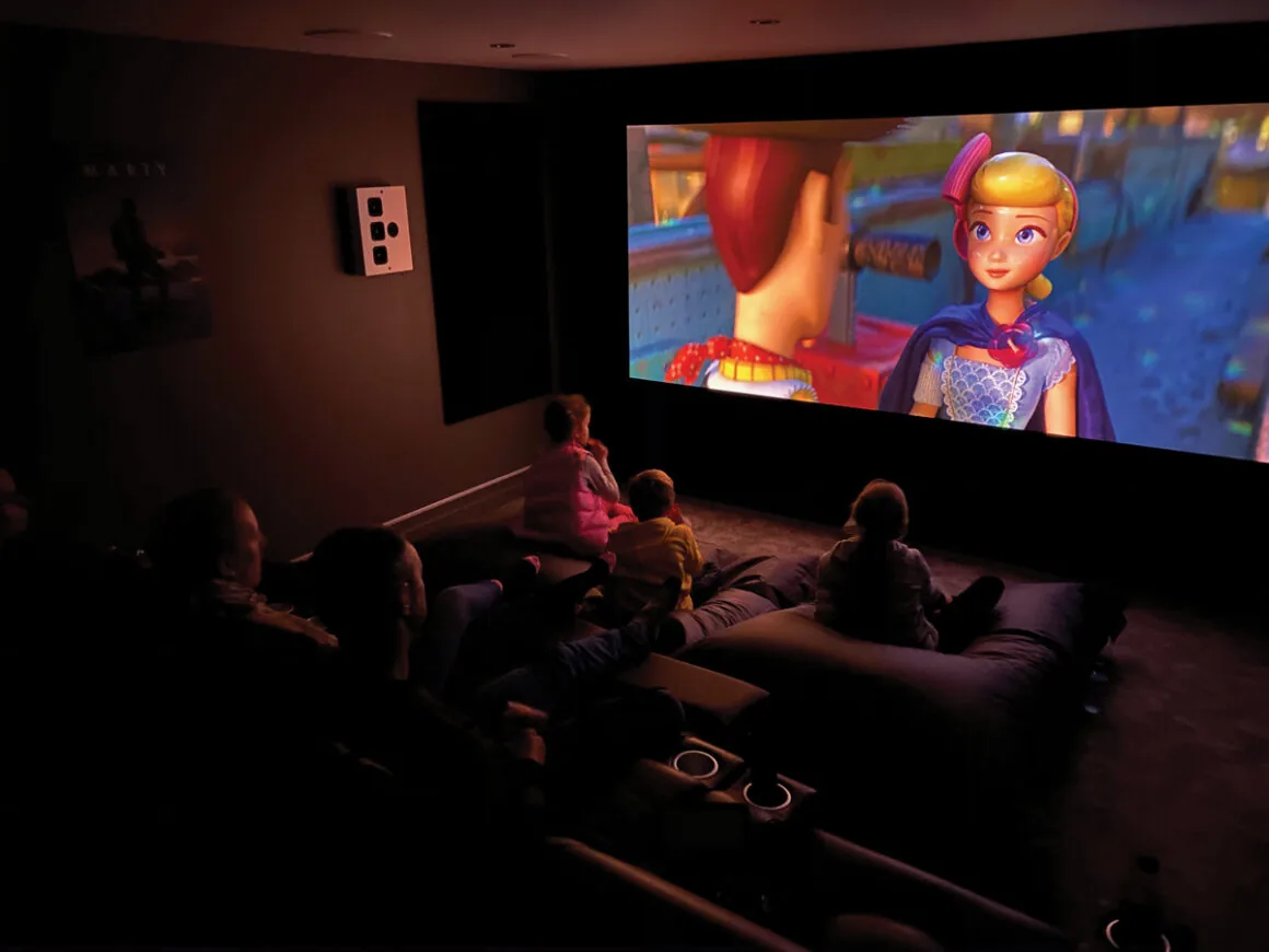 People watching an animated movie in a home cinema room