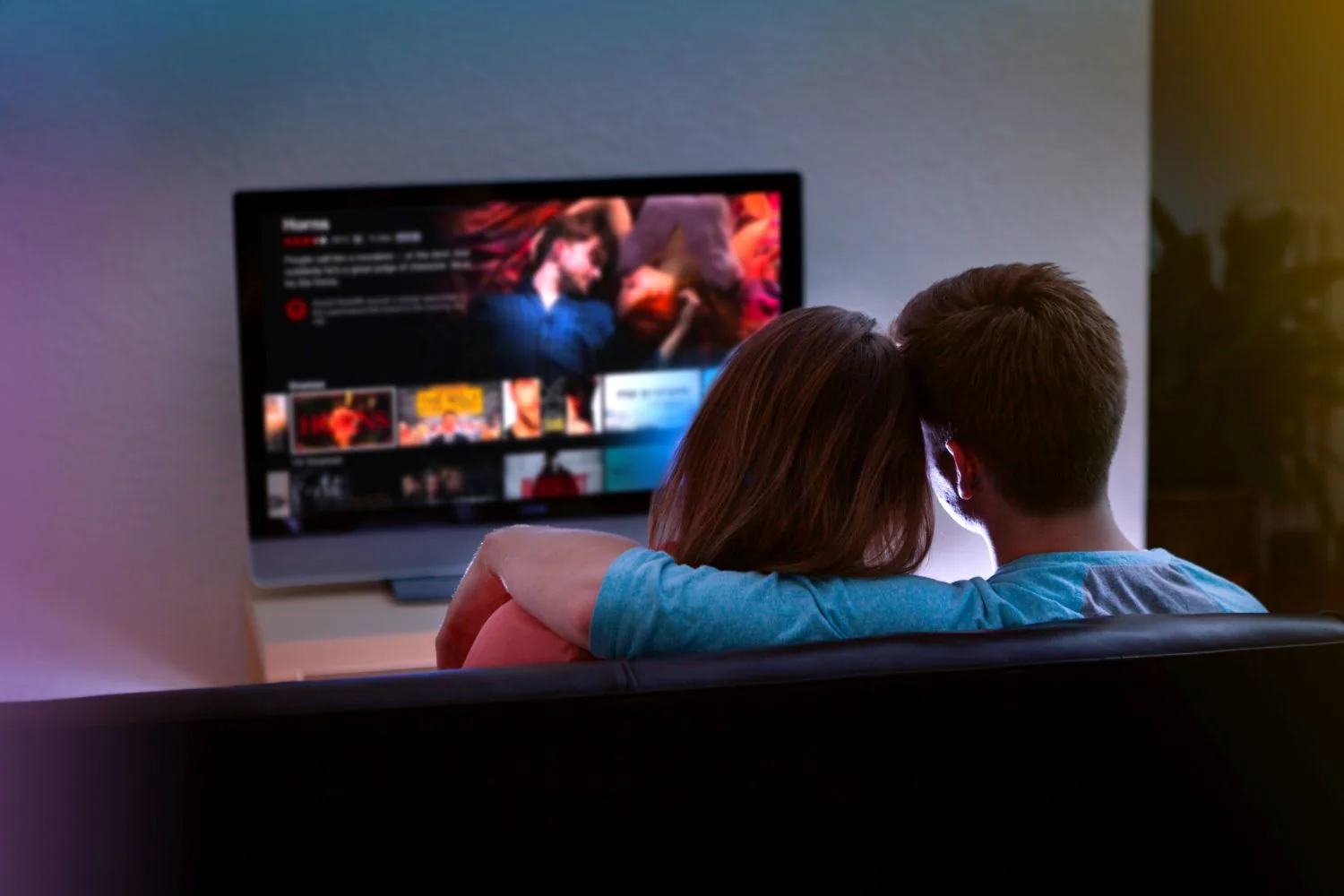 Couple browsing streaming apps on a smart TV