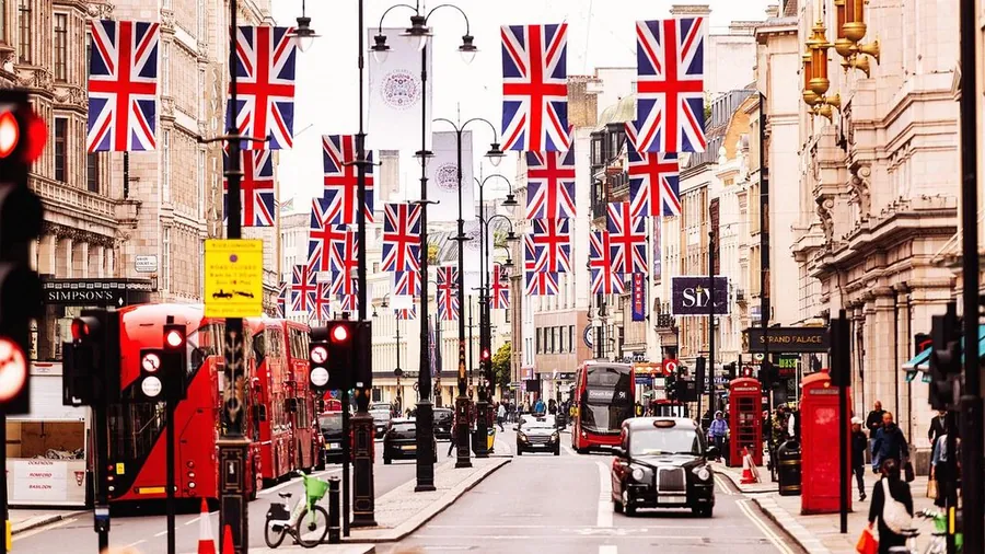 Busy London street with a Union Jack flag on a building
